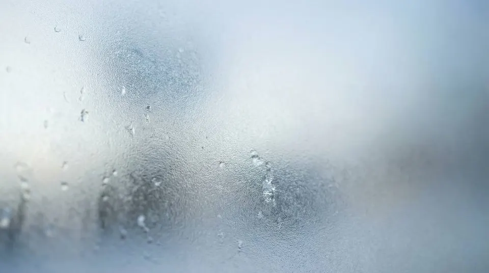 Frosted glass texture with blurred silhouette representing privacy and stock photo legal compliance